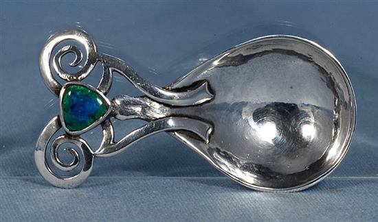 An Edwardian Arts & Crafts silver and enamel caddy spoon, Length 3 ¼”/86mm Width 1 ½”/40mm Weight: 1.2oz/33grms